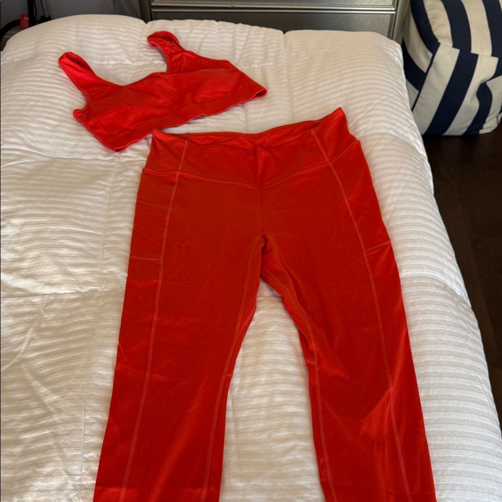Women's Fabletics bright orange workout set leggings and sports bra
